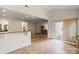 Bright open floor plan with tiled floors leading to a comfortable living area with access to the backyard at 2177 Galloway Sw Ln, Concord, NC 28025