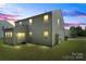 View of the back exterior showing a yard and sunroom at 2177 Galloway Sw Ln, Concord, NC 28025