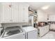 Well-organized kitchen with ample storage, marble countertops, and modern appliances, integrated with laundry facilities at 2205 Centergrove Rd, Kannapolis, NC 28083