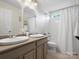 Bright bathroom offers double sinks, light fixtures, and shower/tub area, perfect for families at 2907 Blackburn Dr, Waxhaw, NC 28173