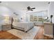 Cozy bedroom with a plush bed, soft lighting, area rug, and a view of the backyard at 2907 Blackburn Dr, Waxhaw, NC 28173