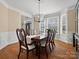 Formal dining room boasting hardwood floors, detailed trim, and a bay window for ample light at 2907 Blackburn Dr, Waxhaw, NC 28173