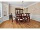 Elegant dining area featuring hardwood floors, detailed trim, and a traditional chandelier at 2907 Blackburn Dr, Waxhaw, NC 28173