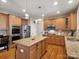 Spacious kitchen featuring granite countertops, stainless steel appliances, an island and ample maple cabinetry at 2907 Blackburn Dr, Waxhaw, NC 28173