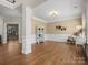 Spacious living room featuring hardwood floors, detailed trim, and lots of natural light at 2907 Blackburn Dr, Waxhaw, NC 28173