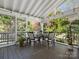 Charming covered porch with outdoor seating and a view of the surrounding greenery at 2907 Blackburn Dr, Waxhaw, NC 28173