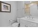 Well-lit bathroom with vanity, toilet, and shower, showcasing a clean and modern design at 3013 Arsdale Rd, Waxhaw, NC 28173