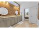This full bathroom has a double sink, a large vanity, and a window providing natural light at 3013 Arsdale Rd, Waxhaw, NC 28173