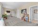 Spacious carpeted playroom with natural light, features toy kitchen and wall-mounted TV at 3013 Arsdale Rd, Waxhaw, NC 28173