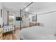 A bedroom with bright, natural light, a metal frame bed, and views of the neighborhood at 3013 Arsdale Rd, Waxhaw, NC 28173
