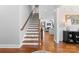 Inviting foyer with hardwood floors, staircase, and a glimpse into the living room at 3013 Arsdale Rd, Waxhaw, NC 28173