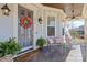 Inviting front porch featuring a cozy seating area, decorative wreath, and a 'Welcome' mat at 3013 Arsdale Rd, Waxhaw, NC 28173