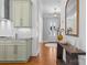Inviting foyer featuring wood floors, an accent table, and a view into the kitchen at 3013 Arsdale Rd, Waxhaw, NC 28173
