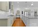 Bright kitchen features marble countertops, stainless steel appliances, and hardwood floors at 3013 Arsdale Rd, Waxhaw, NC 28173