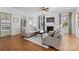 Cozy living room features a fireplace, large windows, and comfortable seating at 3013 Arsdale Rd, Waxhaw, NC 28173