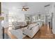 Bright living room open to kitchen, features fireplace, large windows, and comfortable seating at 3013 Arsdale Rd, Waxhaw, NC 28173