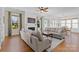 Bright living room features a fireplace, large windows, and comfortable seating at 3013 Arsdale Rd, Waxhaw, NC 28173