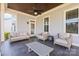 Covered patio with comfortable seating, ceiling fan, and tiled floor provides a relaxing outdoor space at 3013 Arsdale Rd, Waxhaw, NC 28173