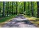 Scenic walking path through the woods, ideal for a peaceful stroll at 3254 Maple Ridge Dr, Gastonia, NC 28052