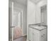 Bathroom featuring granite countertop vanity and an open doorway to the hallway at 3418 Saddlebred Dr, Gastonia, NC 28052