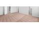 Large bedroom featuring neutral colored carpet, white walls and walk-in closet at 3418 Saddlebred Dr, Gastonia, NC 28052