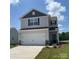 Charming two-story home with a two-car garage, light gray siding, and a well-manicured lawn at 3418 Saddlebred Dr, Gastonia, NC 28052