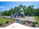 Outdoor playground features climbing structures, slides and swings in a landscaped setting at 3418 Saddlebred Dr, Gastonia, NC 28052