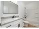 Bathroom featuring granite counters, modern fixtures, and a tub shower combo at 407 S Spargo St, Dallas, NC 28034