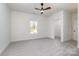 Bedroom with a window for natural light, closet, and ceiling fan at 407 S Spargo St, Dallas, NC 28034