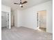 Bedroom with a window for natural light, closet, ceiling fan, and en suite bathroom at 407 S Spargo St, Dallas, NC 28034