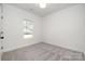 Cozy bedroom featuring a window for natural light and neutral carpet at 407 S Spargo St, Dallas, NC 28034