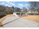 Corner lot showcasing new home, long drive, manicured front yard, and inviting front porch at 407 S Spargo St, Dallas, NC 28034