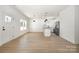 Open-concept floor plan with luxury vinyl flooring and an eat-in kitchen at 407 S Spargo St, Dallas, NC 28034