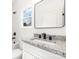 Bathroom featuring vanity with dark fixtures, a white sink, and a framed mirror above the sink at 409 S Spargo St, Dallas, NC 28034