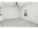 Neutral carpet in the bedroom and white walls make the room seem spacious and clean at 409 S Spargo St, Dallas, NC 28034