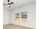 A bedroom with white walls, light wood laminate flooring, and a window at 409 S Spargo St, Dallas, NC 28034