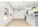 Modern kitchen features white cabinetry, granite countertops, stainless appliances, and a center island at 409 S Spargo St, Dallas, NC 28034