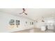 Bright, open-concept space featuring laminate flooring, white walls and modern lighting fixtures at 409 S Spargo St, Dallas, NC 28034