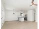 Bright, open-concept space featuring laminate flooring, white walls, stainless steel appliances, and modern lighting at 409 S Spargo St, Dallas, NC 28034