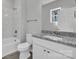 Bathroom featuring a tub and shower combination and granite vanity at 427 Queens Ct, Gastonia, NC 28052