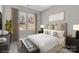 Bedroom with neutral decor, large windows, and comfortable furnishings at 427 Queens Ct, Gastonia, NC 28052