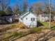Rear home view surrounded by trees and lawns at 427 Queens Ct, Gastonia, NC 28052