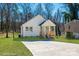 Charming home featuring a well-manicured lawn, ample parking space, and a cozy front porch at 427 Queens Ct, Gastonia, NC 28052