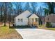 Charming home featuring a well-manicured lawn, ample parking space, and a cozy front porch at 427 Queens Ct, Gastonia, NC 28052