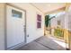 Inviting front porch featuring a white door, a window, and a charming railing at 427 Queens Ct, Gastonia, NC 28052