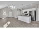 Updated kitchen and living area with a modern island, stainless appliances, and a stylish ceiling fan at 427 Queens Ct, Gastonia, NC 28052