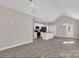 Spacious open-concept living area flows into the kitchen with stainless steel appliances and an island at 427 Queens Ct, Gastonia, NC 28052