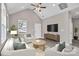 Comfortable living room with vaulted ceiling, stylish furniture, and a large flat screen TV at 427 Queens Ct, Gastonia, NC 28052