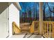 Inviting front porch featuring a wooden railing and steps leading to a spacious yard at 427 Queens Ct, Gastonia, NC 28052