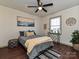 Comfortable bedroom with modern decor, wood floors, and a large window at 4516 Jamee Dr, Gastonia, NC 28056